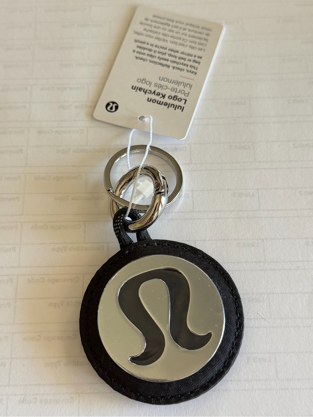 Lululemon Round Logo Keychain in Black and Silver